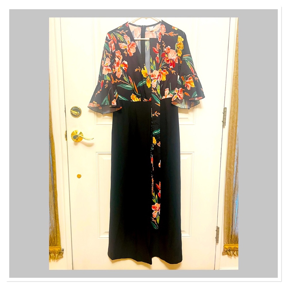 Women’s jumpsuit size M. Black with flower print.